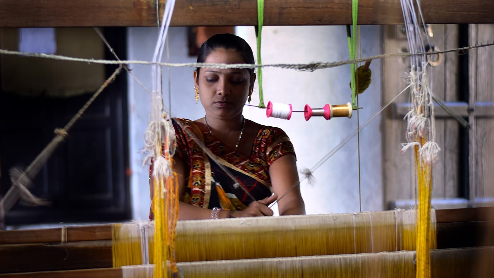 Handloom artisan working with traditional natural fibers