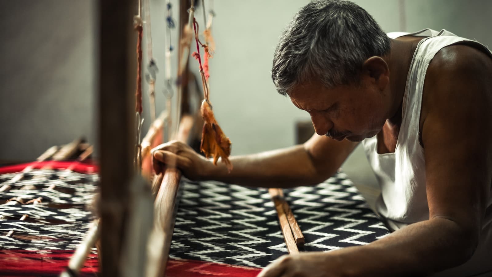 Traditional handloom artisan weaving colorful Mexican textiles