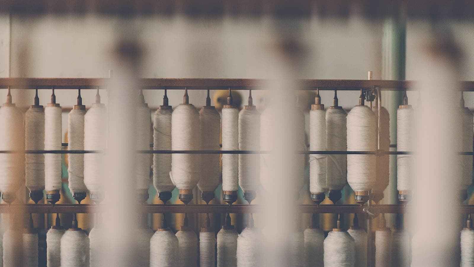 Spools of white cotton thread representing Ethiopia’s cotton and spinning base