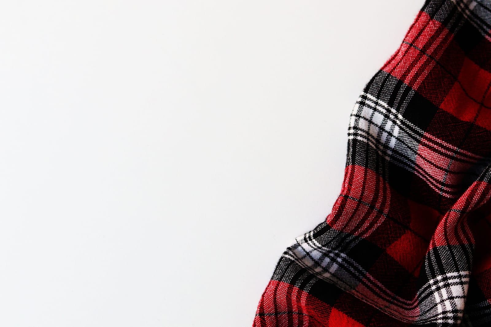 Red, black and white plaid flannel fabric with a soft brushed surface