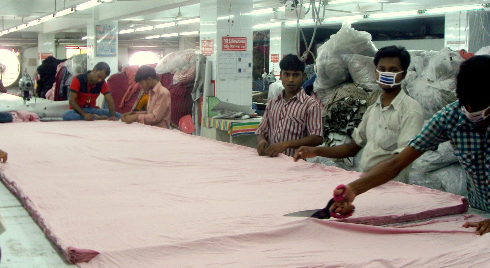 Pattern making and fabric cutting in a garment production unit