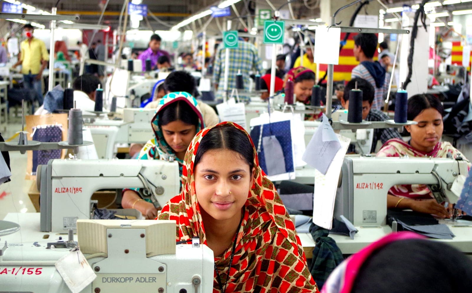 Sewing floor of a modern garment factory with rows of operators