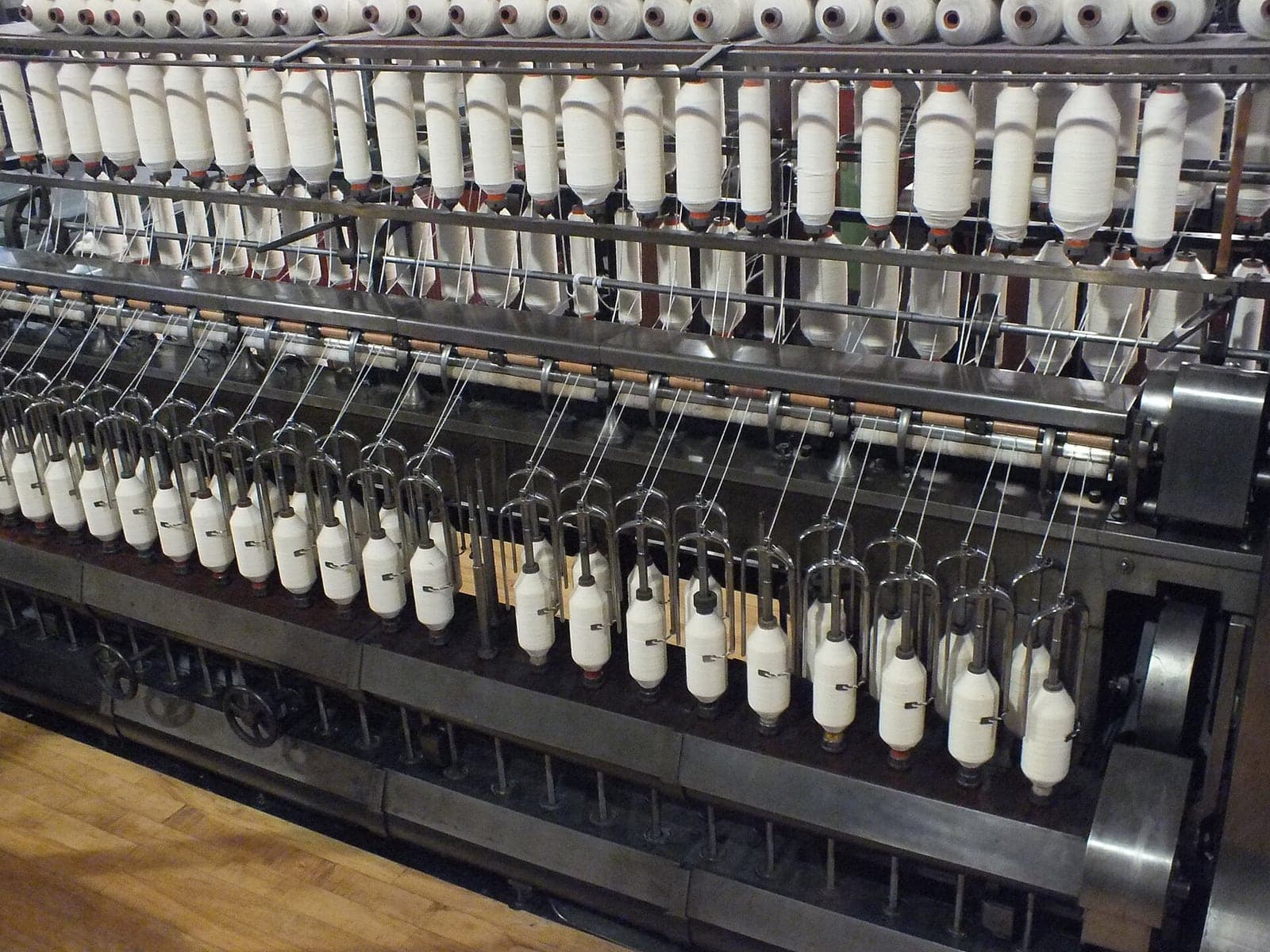 Ring-spinning machines running in a modern textile mill managed with textile ERP software